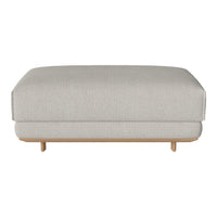 Light gray upholstered ottoman with a sleek design and natural wood legs, featuring a smooth, textured pattern.