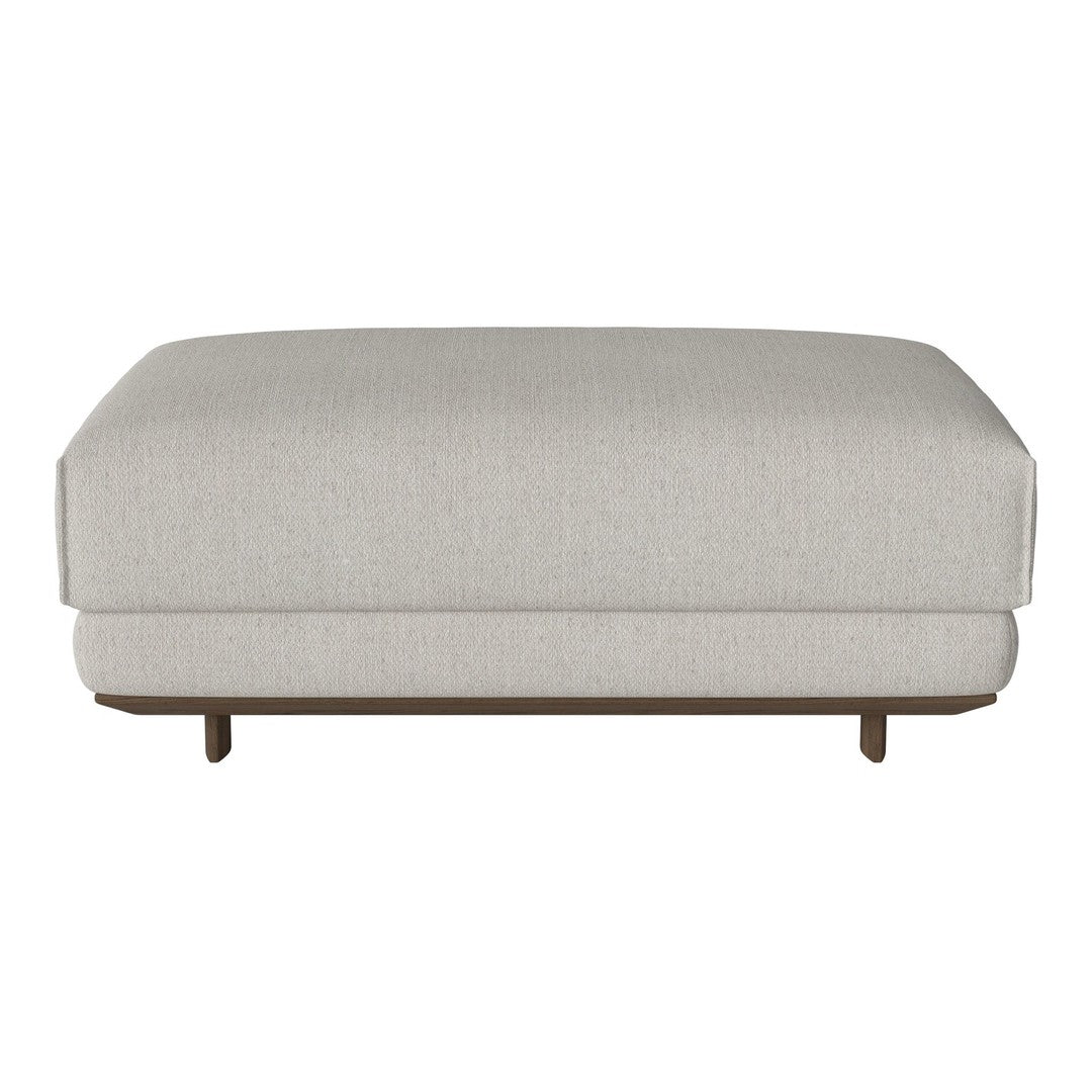 Light beige upholstered ottoman with subtle texture and wooden base. Minimalist design fits various decor styles.