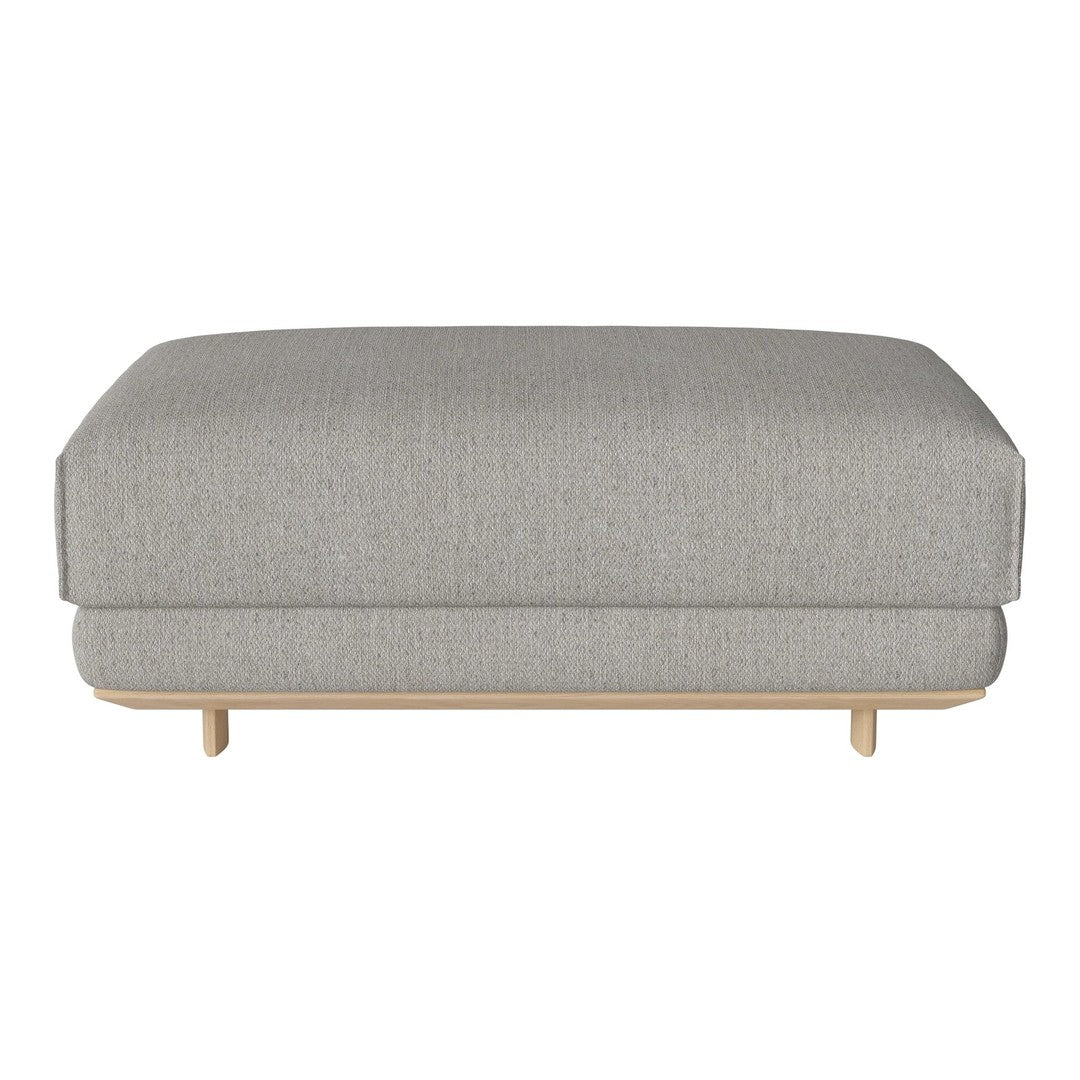 Light grey upholstered ottoman with a subtle textured pattern and natural wood legs. Stylish and modern design.