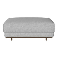Gray upholstered ottoman with clean lines and a minimalist design, featuring a smooth texture and wooden legs.