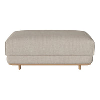 Neutral beige ottoman with a smooth texture and minimalist design, featuring light wooden legs for a modern touch.