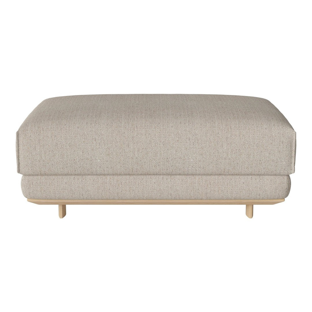Beige upholstered ottoman with a smooth, textured pattern and wooden legs, ideal for modern interiors.