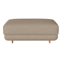 Beige fabric ottoman with a smooth, textured surface and minimalist design on natural wood legs.