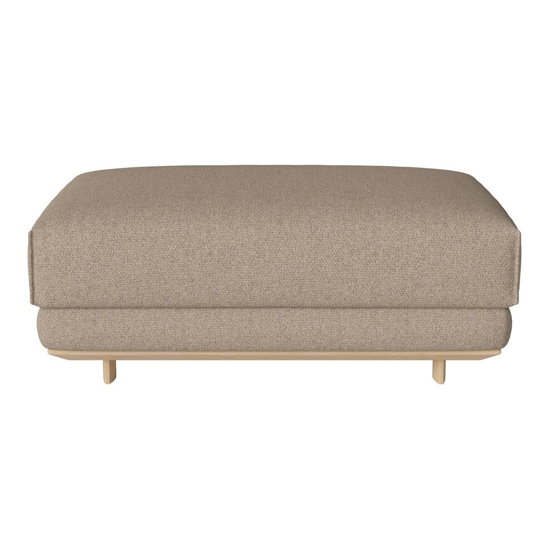 Beige upholstered ottoman with a smooth, minimalist design and light wooden legs. Ideal for modern interiors.