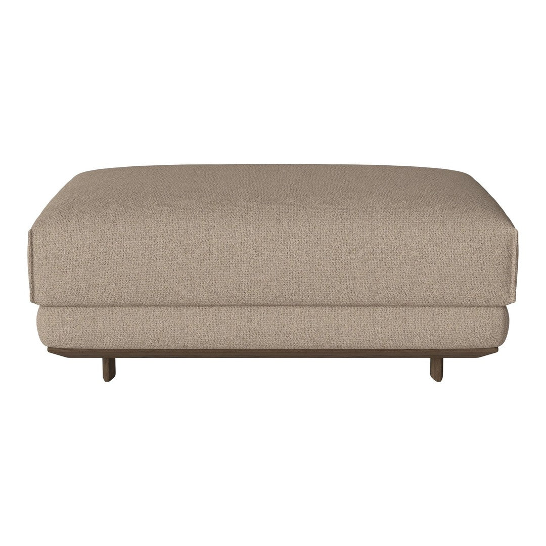 Beige textured ottoman with a smooth surface and minimalist design, featuring subtle stitching and wooden legs.