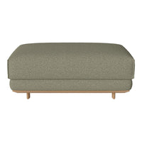 Olive green textured ottoman with a subtle pattern and light wooden legs for a modern touch.