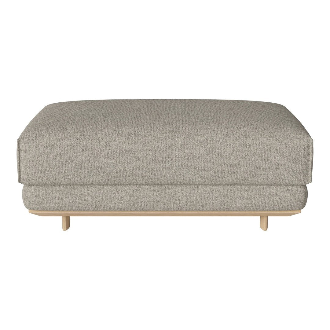 Gray upholstered ottoman with a smooth texture and minimalist design on a light wooden base.