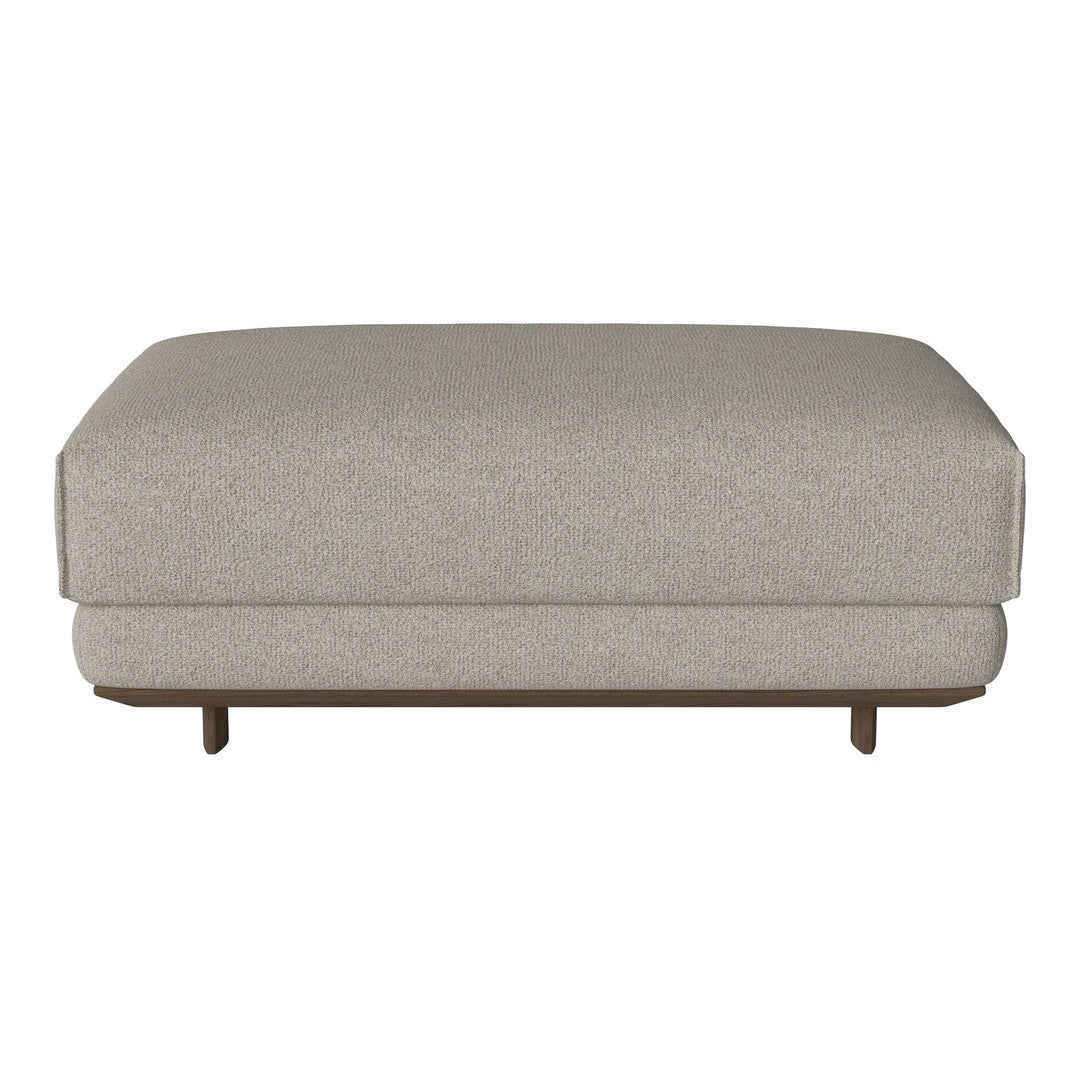 Light gray upholstered ottoman with a smooth texture and subtle pattern, featuring elegant wooden legs.