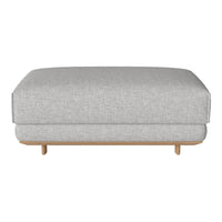 Gray fabric ottoman with a minimalist design and wooden base, offering a modern aesthetic. No visible patterns.