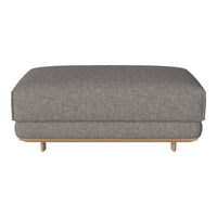 Gray fabric ottoman with a textured finish and natural wood legs, perfect for modern decor.