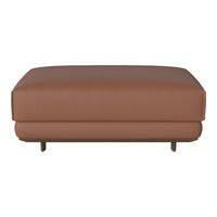 Brown leather ottoman with a smooth, modern design and subtle stitching details.