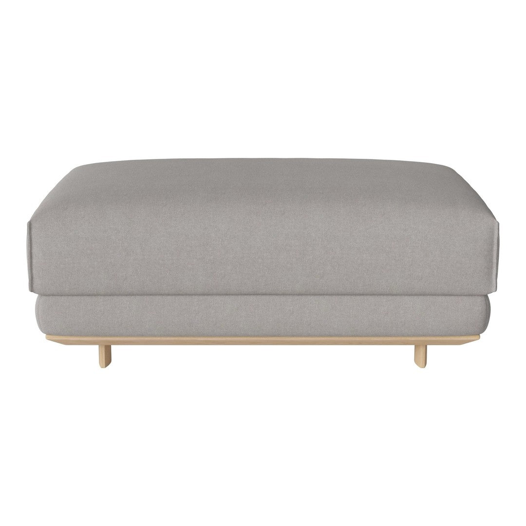 Gray upholstered ottoman with a smooth texture and minimalist design, featuring light wooden legs.