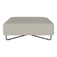 Light beige ottoman with a smooth fabric texture and sleek black metal legs. Modern design for versatile decor.
