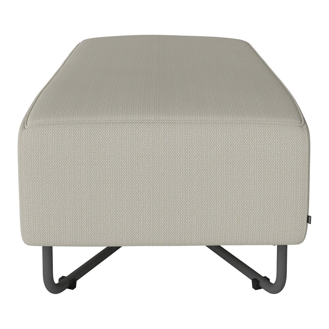 Beige textured ottoman with a minimalist design and metal legs, perfect for modern decor.