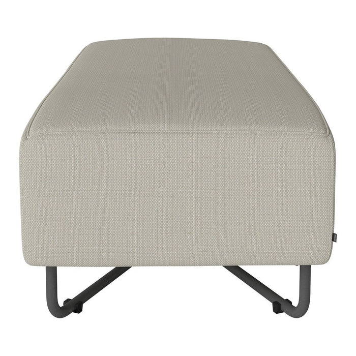 Beige textured ottoman with a minimalist design and metal legs, perfect for modern decor.