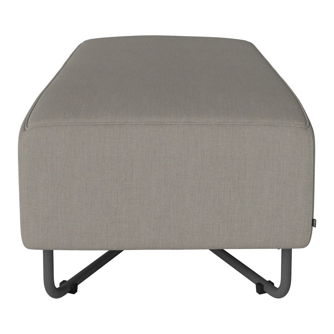 Gray tufted ottoman with a sleek, modern design and minimalist metal legs, perfect for contemporary decor.