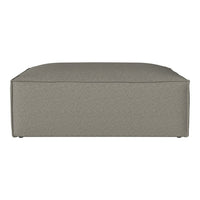 Gray upholstered ottoman with a textured fabric pattern and clean, modern edges. Ideal for contemporary decor.