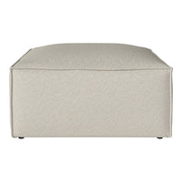Beige textured square ottoman with a subtle pattern, perfect for modern home decor.