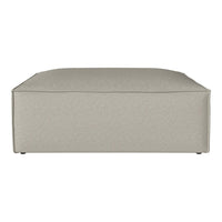 Light beige upholstered ottoman with a smooth, minimalist design and no visible patterns. Ideal for modern decor.