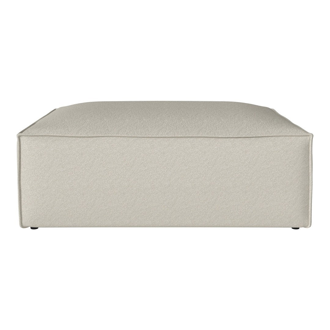 Light beige upholstered ottoman with a smooth, textured surface. Ideal for modern and minimalist decor.