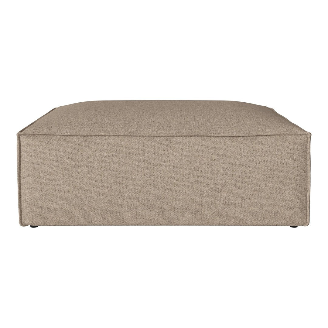 Beige square ottoman with a smooth, textured fabric finish. Simple, modern design complements various decor styles.