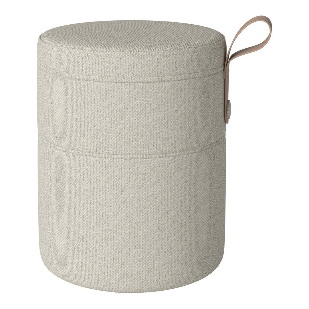 Light beige cylindrical storage container with a textured finish and a leather handle.