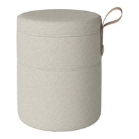 Light beige cylindrical storage container with a textured finish and a leather handle.