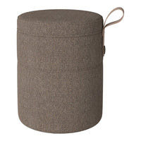 Round storage ottoman in a textured brown fabric with a subtle weave pattern and a convenient side handle.