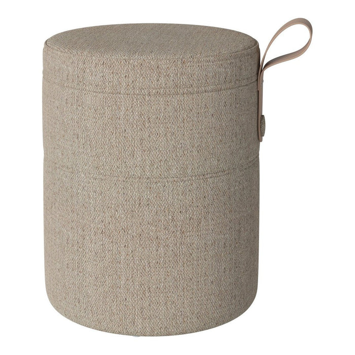 Beige cylindrical storage ottoman with a textured pattern and a stylish leather handle. Perfect for modern decor.