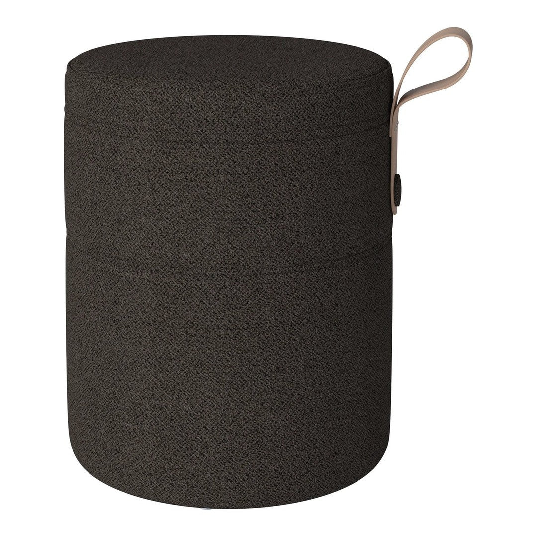 Round black storage container with a smooth texture and a beige handle detail. Ideal for stylish organization.