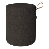 Round black storage container with a smooth texture and a beige handle detail. Ideal for stylish organization.