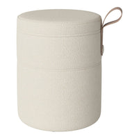 Cream textured round storage ottoman with a minimalistic design and a light brown handle.
