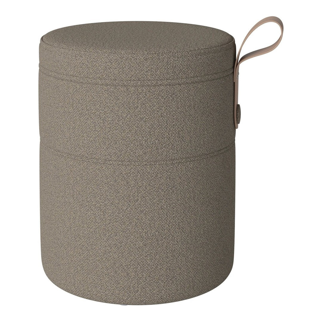 Taupe round storage container with a textured finish and integrated handle. Ideal for stylish organization.