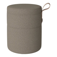 Taupe round storage container with a textured finish and integrated handle. Ideal for stylish organization.
