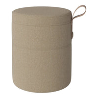 Beige fabric storage ottoman with a smooth texture and subtle sparkle, featuring a decorative handle.