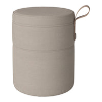 Neutral beige storage ottoman with a smooth texture and subtle seam detail, featuring a convenient handle.