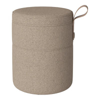 Round, textured storage ottoman in a warm beige hue with a seamless design and practical side handle.