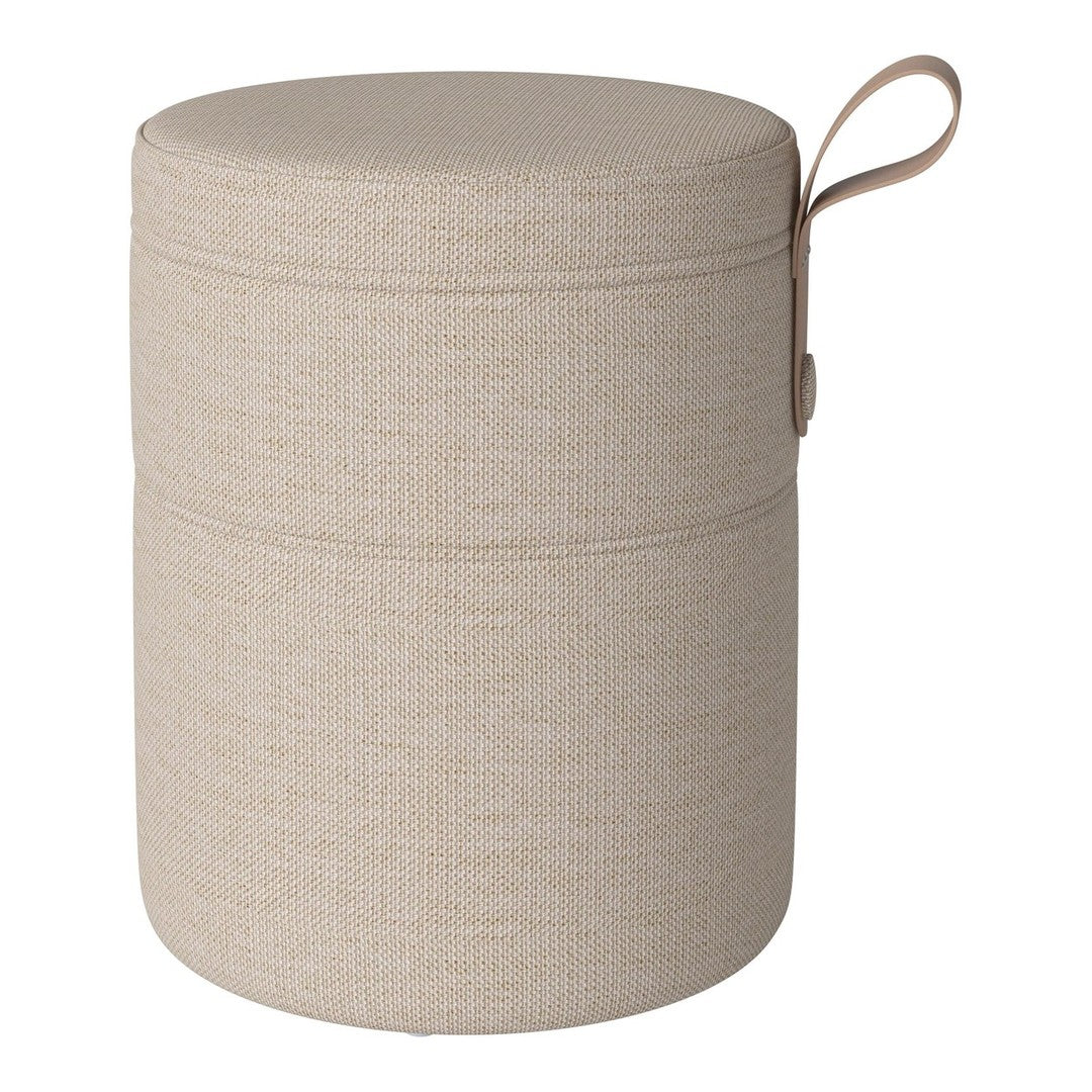 Neutral beige round storage ottoman with a subtle textured pattern and a convenient carrying handle.