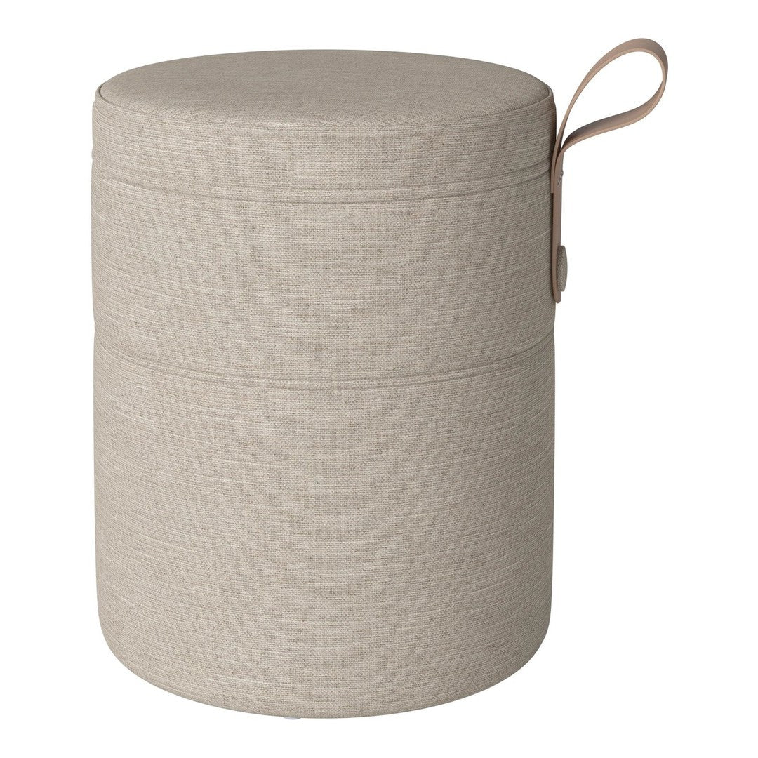 Beige textured storage ottoman with a smooth finish and a stylish fabric pattern. Ideal for modern home decor.