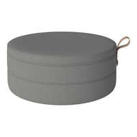 Round gray pouf with textured pattern and tan handle, perfect for stylish seating and decor.