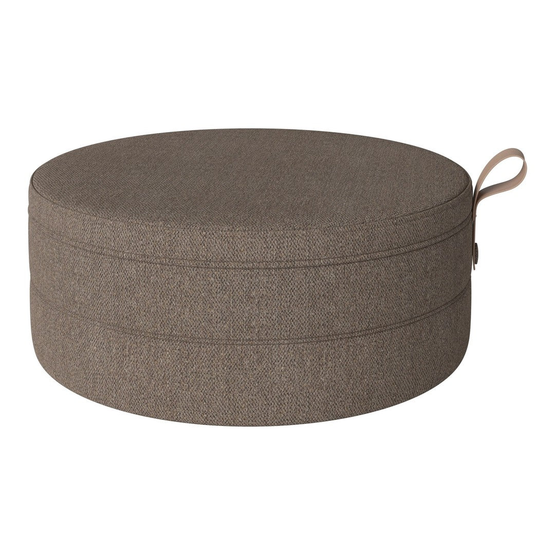 Round, textured pouf in a warm, earthy brown tone, featuring a subtle woven pattern and a convenient handle.