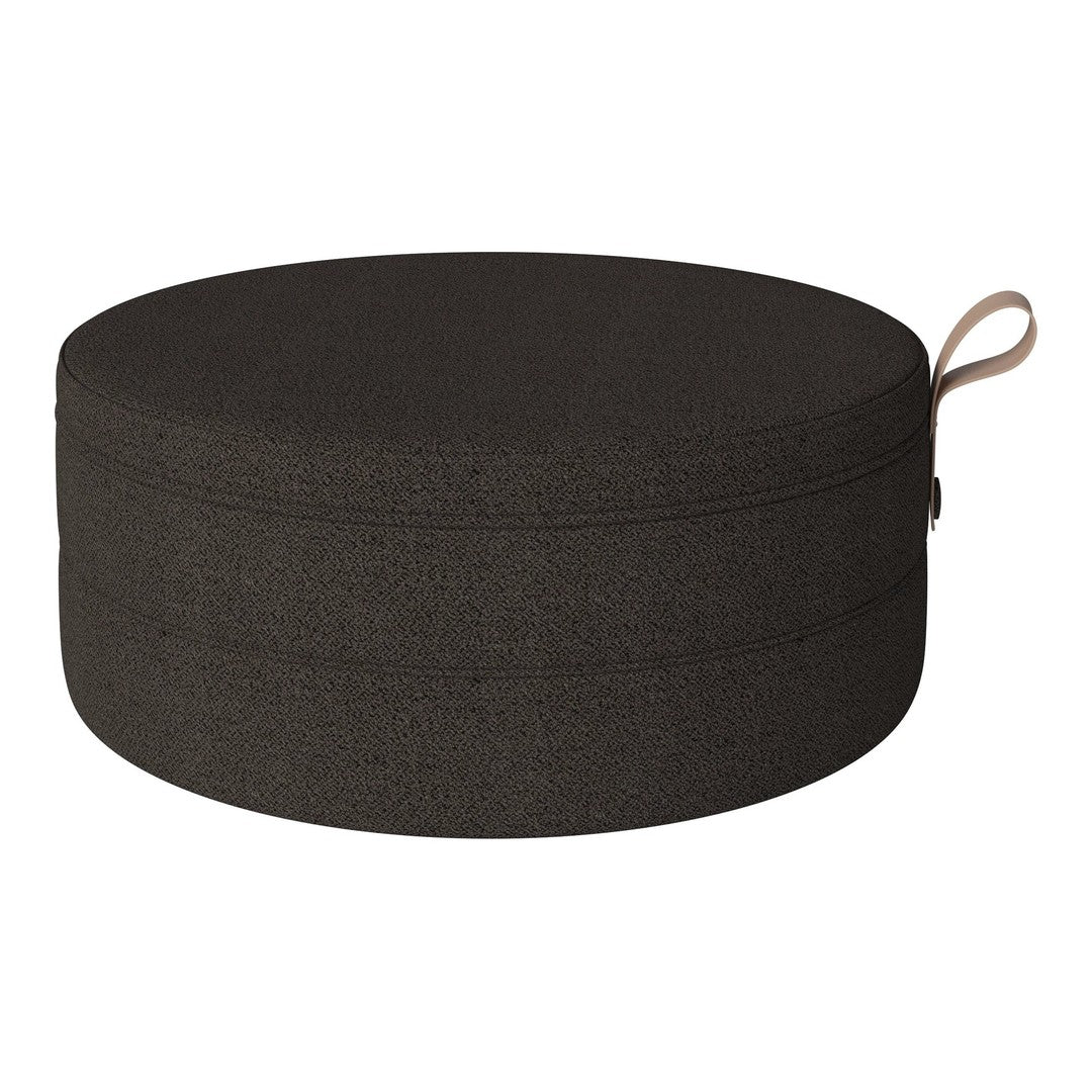 Round black fabric storage ottoman with a smooth texture and subtle stitching details.