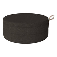 Round black fabric storage ottoman with a smooth texture and subtle stitching details.