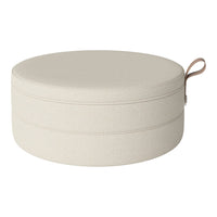 Round beige storage pouf with textured fabric and a stylish handle. Perfect for modern decor.
