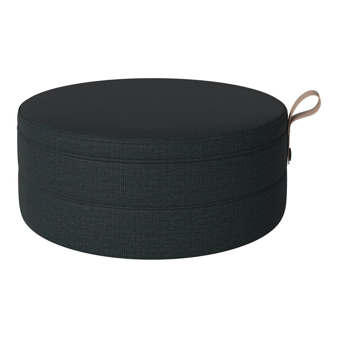 Round storage box in textured dark green with a smooth black lid and a stylish tan handle.