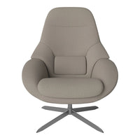 Beige upholstered chair with smooth, modern contours and a sleek metallic base. Elegant and minimalist design.