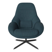 Teal fabric lounge chair with a smooth, textured finish and sleek black metal base. Modern, minimalist design.