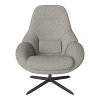 Light gray fabric armchair with smooth, modern curves and a black metal base, featuring a minimalist design.