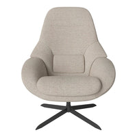 Beige upholstered lounge chair with a smooth, textured fabric and a sleek black metal base. Perfect for modern decor.