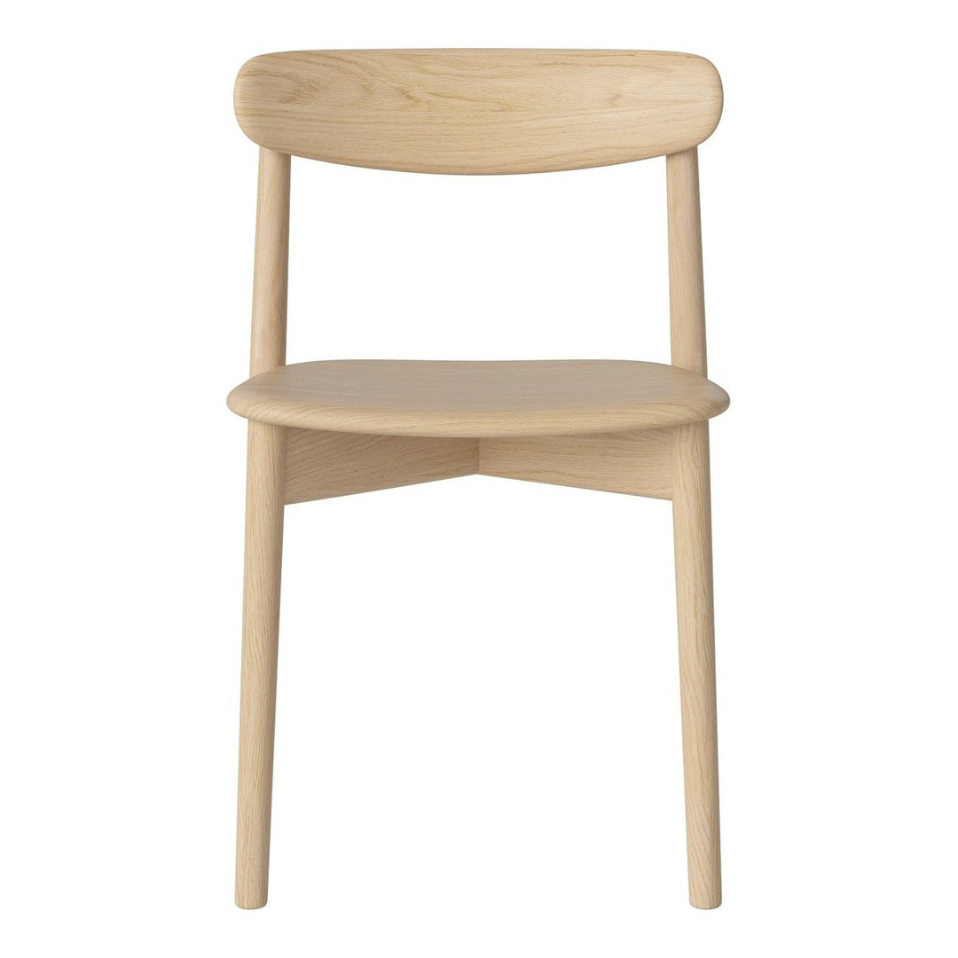 Natural wood chair with a light beige finish and smooth, minimalist design, featuring a curved backrest and simple legs.